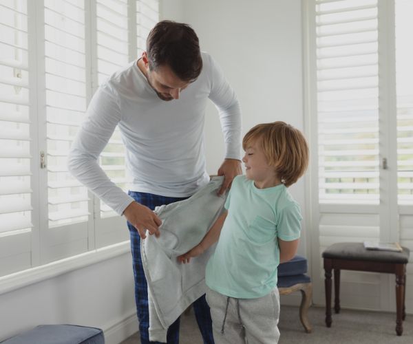 putting on clothes after bed bug heat treatment